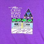 1988 vintage Flint Michigan 8 KM Crim Road Race T-Shirt by Hanes. Purple in color with printed&nbsp; graphics on front and back, tagged size Large and is in excellent condition.