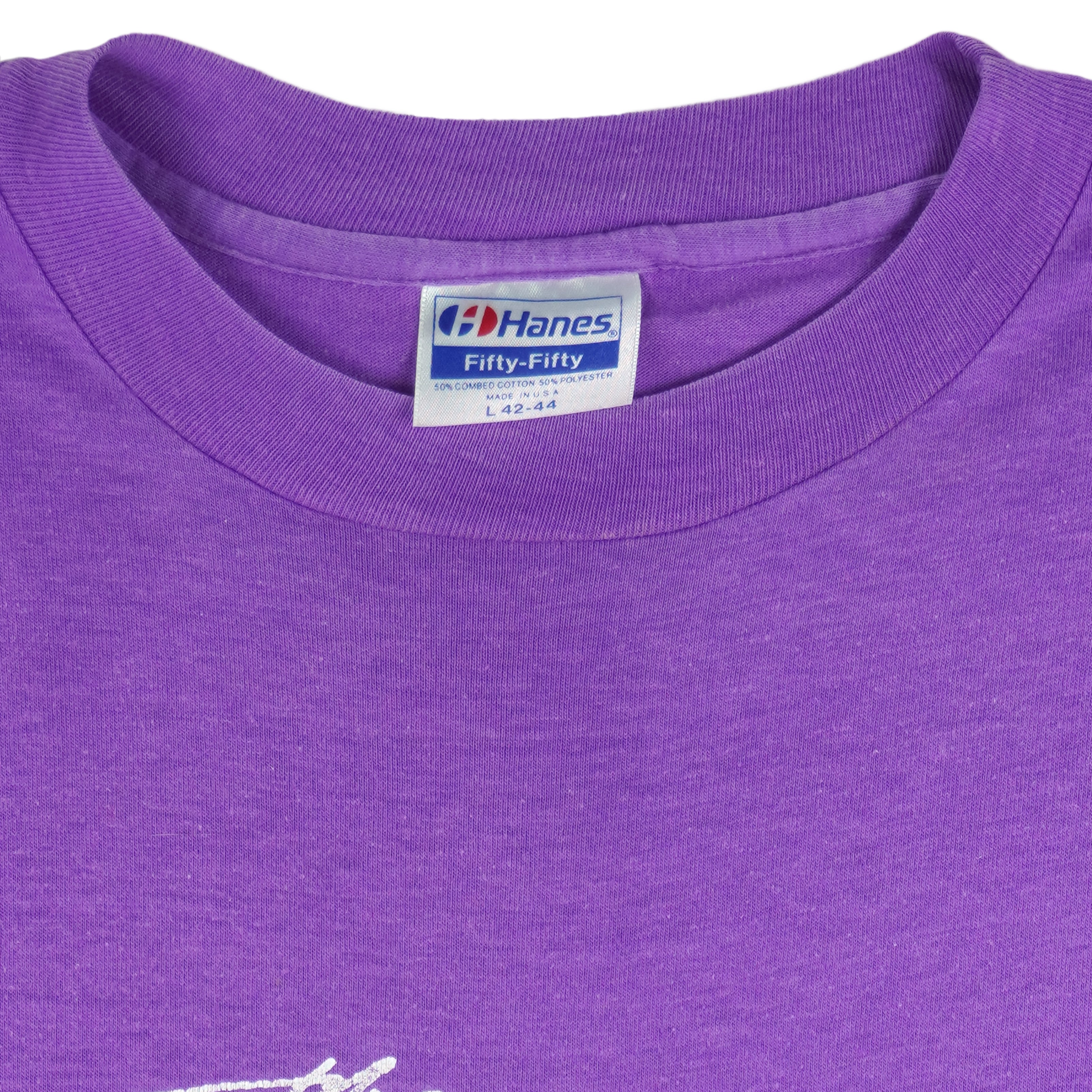 1988 vintage Flint Michigan 8 KM Crim Road Race T-Shirt by Hanes. Purple in color with printed&nbsp; graphics on front and back, tagged size Large and is in excellent condition.