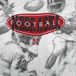NCAA (TSI) - Nebraska Huskers All Over Print T-Shirt 1990s X-Large Vintage Retro Football