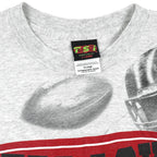 NCAA (TSI) - Nebraska Huskers All Over Print T-Shirt 1990s X-Large Vintage Retro Football