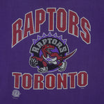 NBA (CGW) - Toronto Raptors Big Spell-Out T-Shirt 1990s X-Large Vintage Retro Basketball
