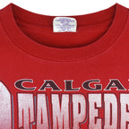 CFL (Waves) - Red Calgary Stampeders Helmet T-Shirt 1990s X-Large Vintage Retro Football