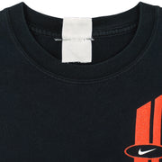Nike - Black Spell-Out T-Shirt 1990s Large Vintage Retro