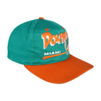 Angled view of the green crown and orange curved brim