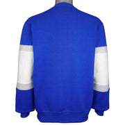 Back of the blue sweatshirt with striped sleeve panels