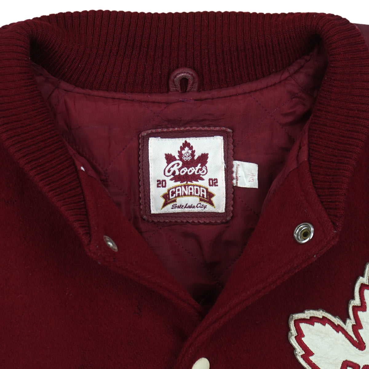 Burgundy and cream Roots Canada Team Canada Salt Lake 2002 varsity jacket
