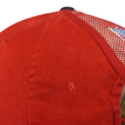 Small frayed tear on a side panel of the red crown
