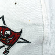 Small brown mark beside the front Buccaneers embroidery