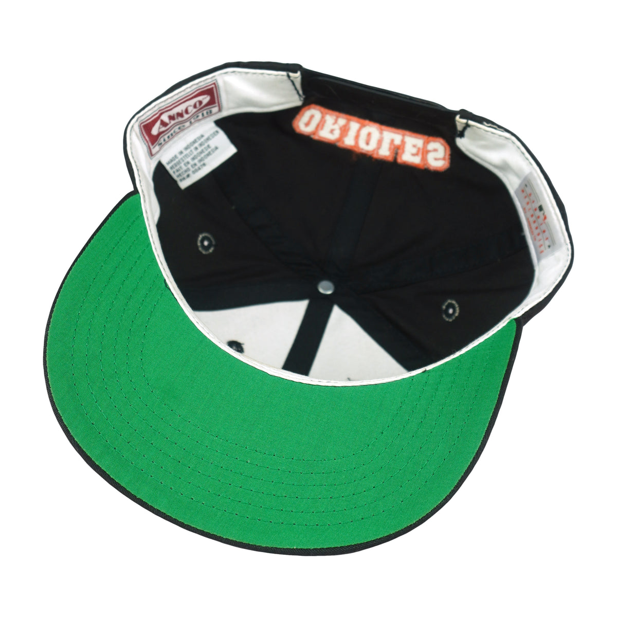 Interior white sweatband and green brim underside of the Orioles hat