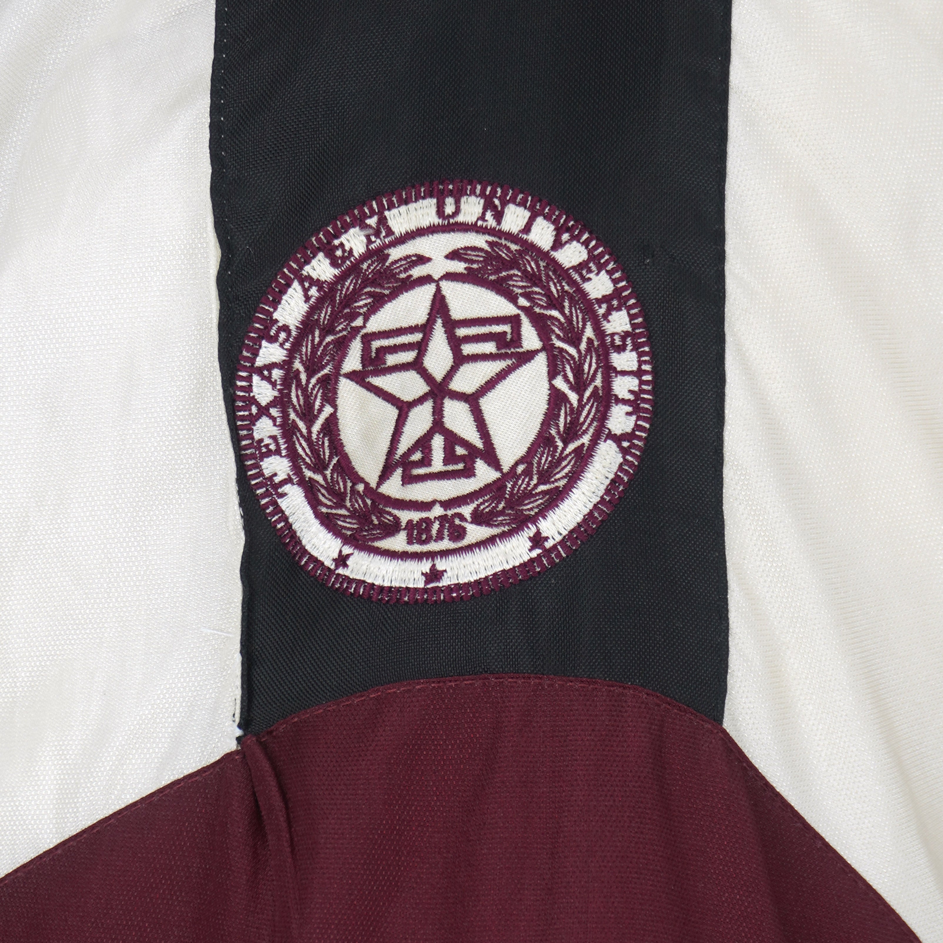 Texas A&M 1876 embroidered seal detail