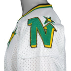 Vintage NHL - Minnesota North Stars Hockey Jersey T-Shirt 1990s Large in black and white and green