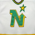 Vintage NHL - Minnesota North Stars Hockey Jersey T-Shirt 1990s Large in black and white and green