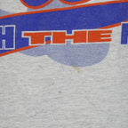 Small brown marks below the Mets front print