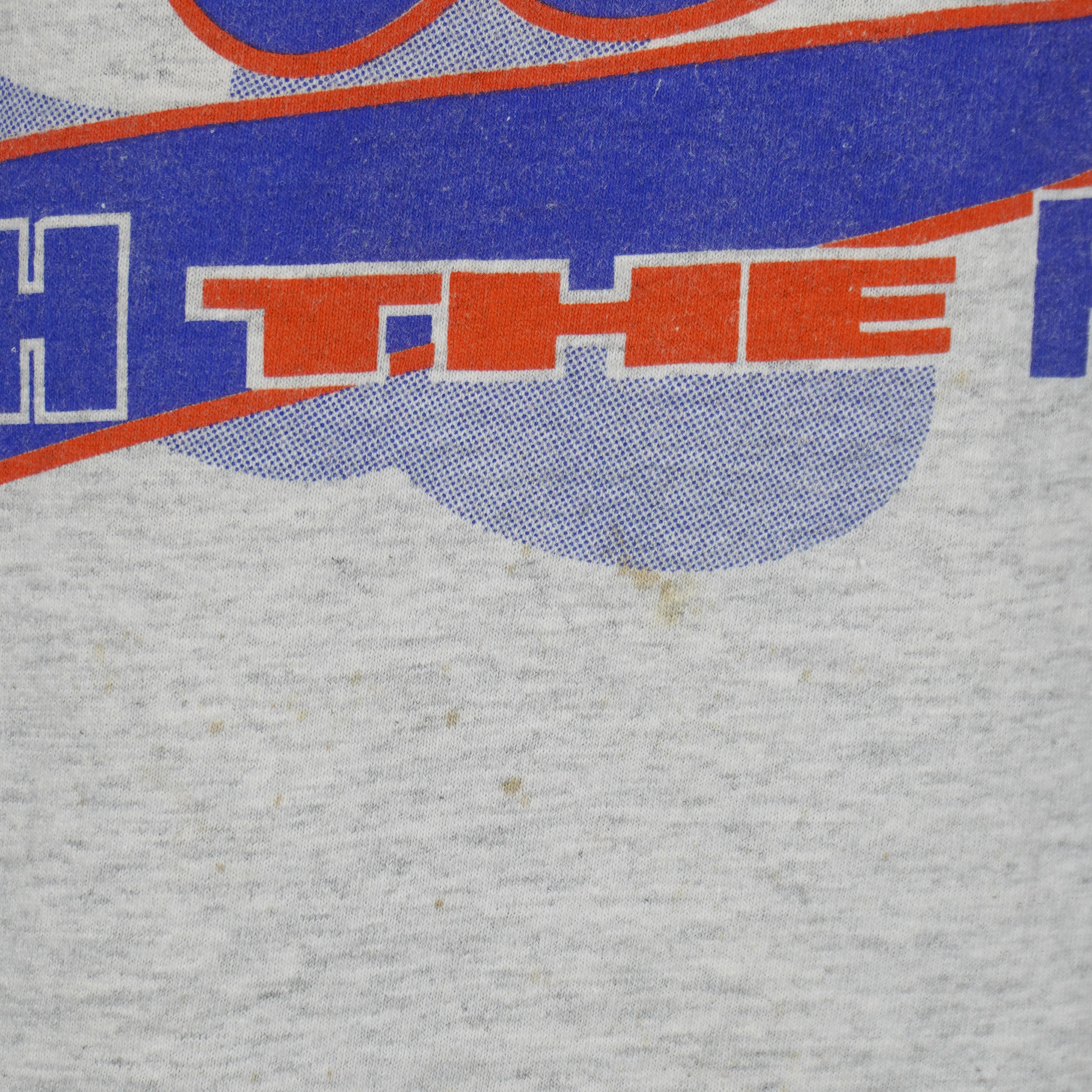 Small brown marks below the Mets front print