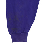 Discoloration and marks on the blue sleeve above the cuff