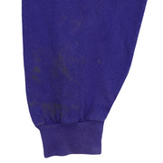 Discoloration and marks on the blue sleeve above the cuff