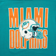 Close view of Miami Dolphins lettering and cracked helmet print