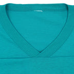 V-neck collar and removed label area of the Dolphins jersey