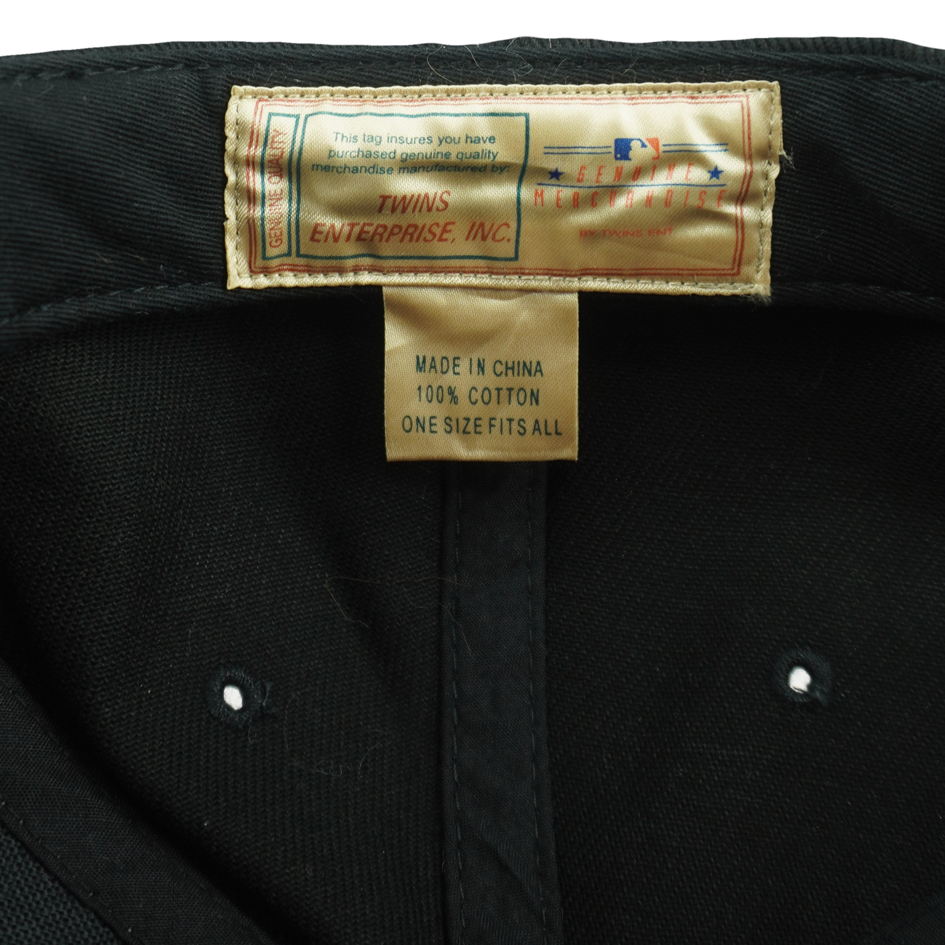 Twins Enterprise and one size fits all labels inside the hat