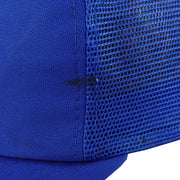 Small dark marks beside the blue Mets hat side seam