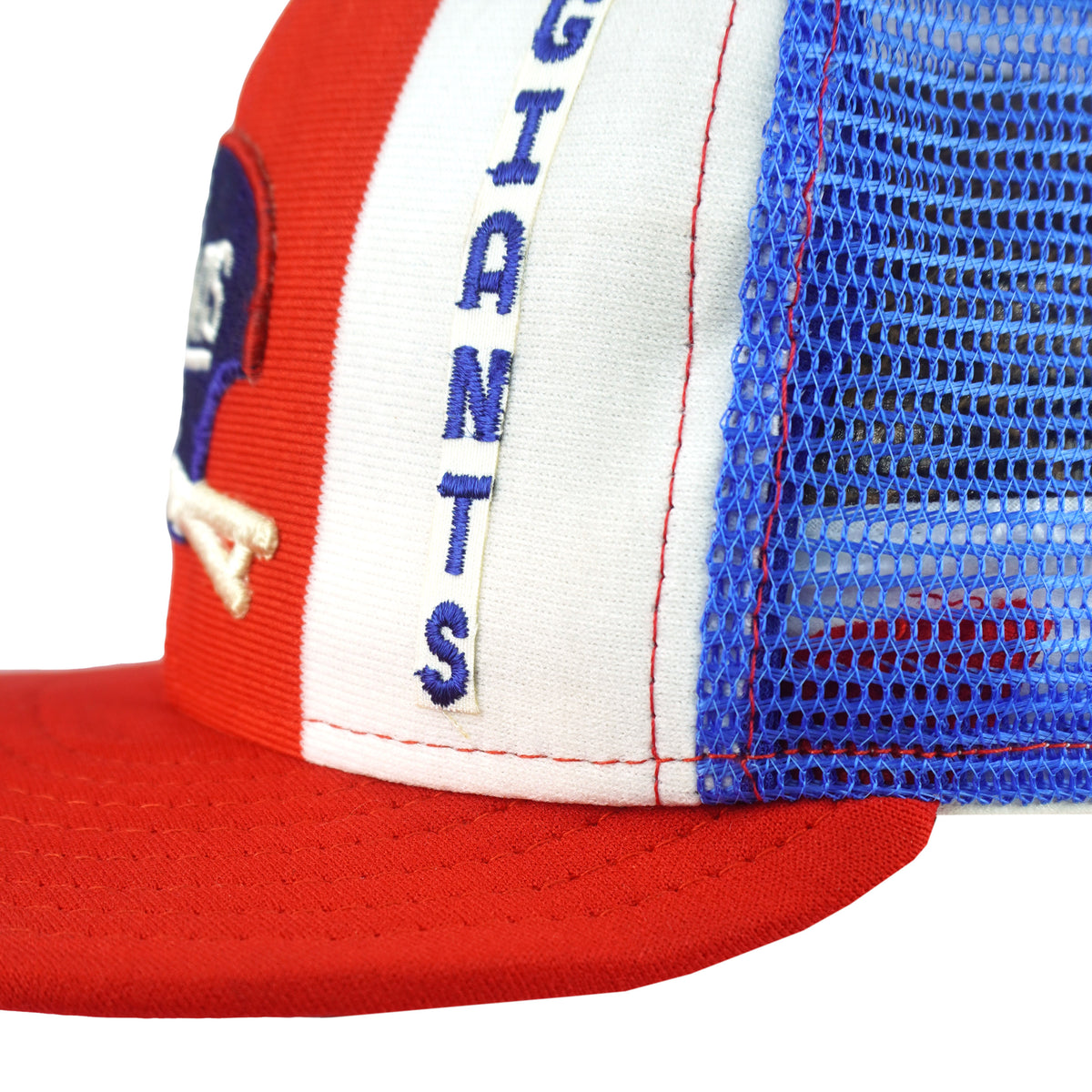 Close view of Giants lettering beside the blue mesh seam