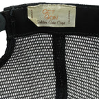 Get Goin Golden Gate Caps label inside the black trucker hat