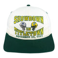 White and green Showdown in Titletown hat with Cowboys and Packers helmets