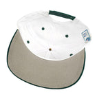 Interior white crown and underside of the green-brimmed hat