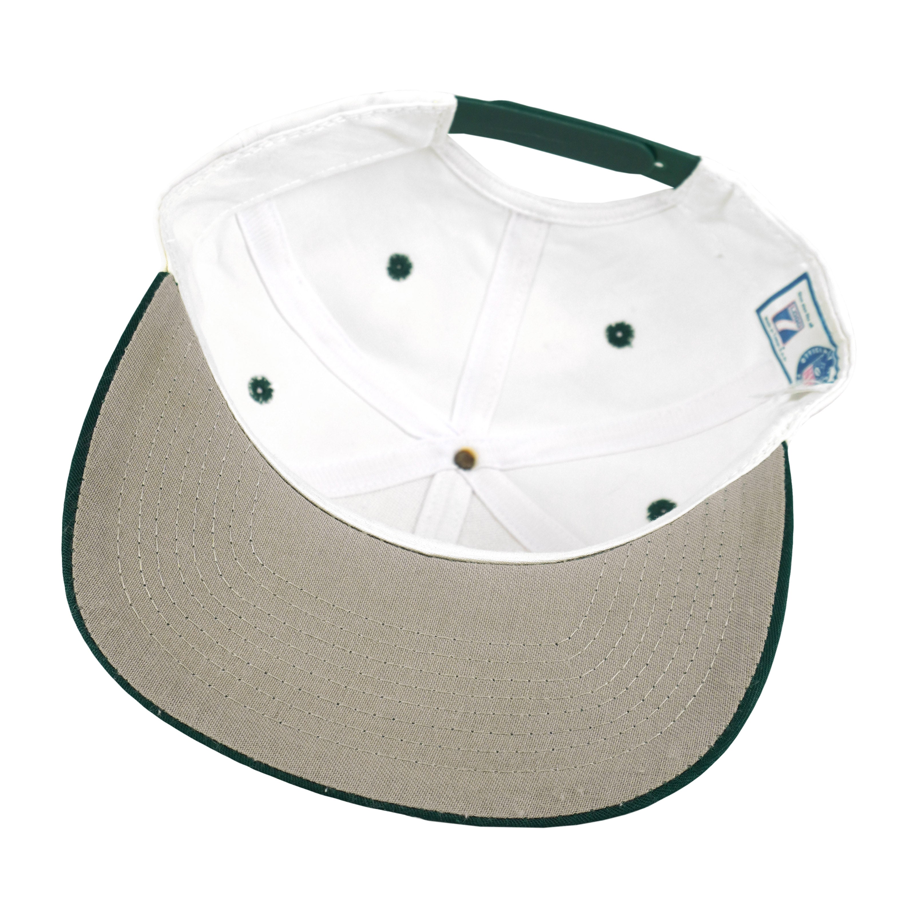 Interior white crown and underside of the green-brimmed hat
