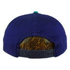 Rear of the blue Mariners cap showing the adjustable plastic snap closure