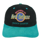 Straight-on front view of the black and teal 1990s New Orleans Bourbon Street snapback cap