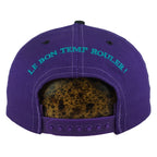 Rear slogan and snap view of the purple, black, and green Hard Rock New Orleans Mardi Gras snapback cap