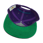 Interior and green underbrim view of the purple, black, and green Hard Rock New Orleans Mardi Gras snapback cap