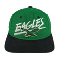 Front view of the green and black 1990s NFL Philadelphia Eagles wraparound-word snapback cap by Signature