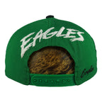 Rear EAGLES snap view of the green and black Philadelphia Eagles wraparound-word snapback cap