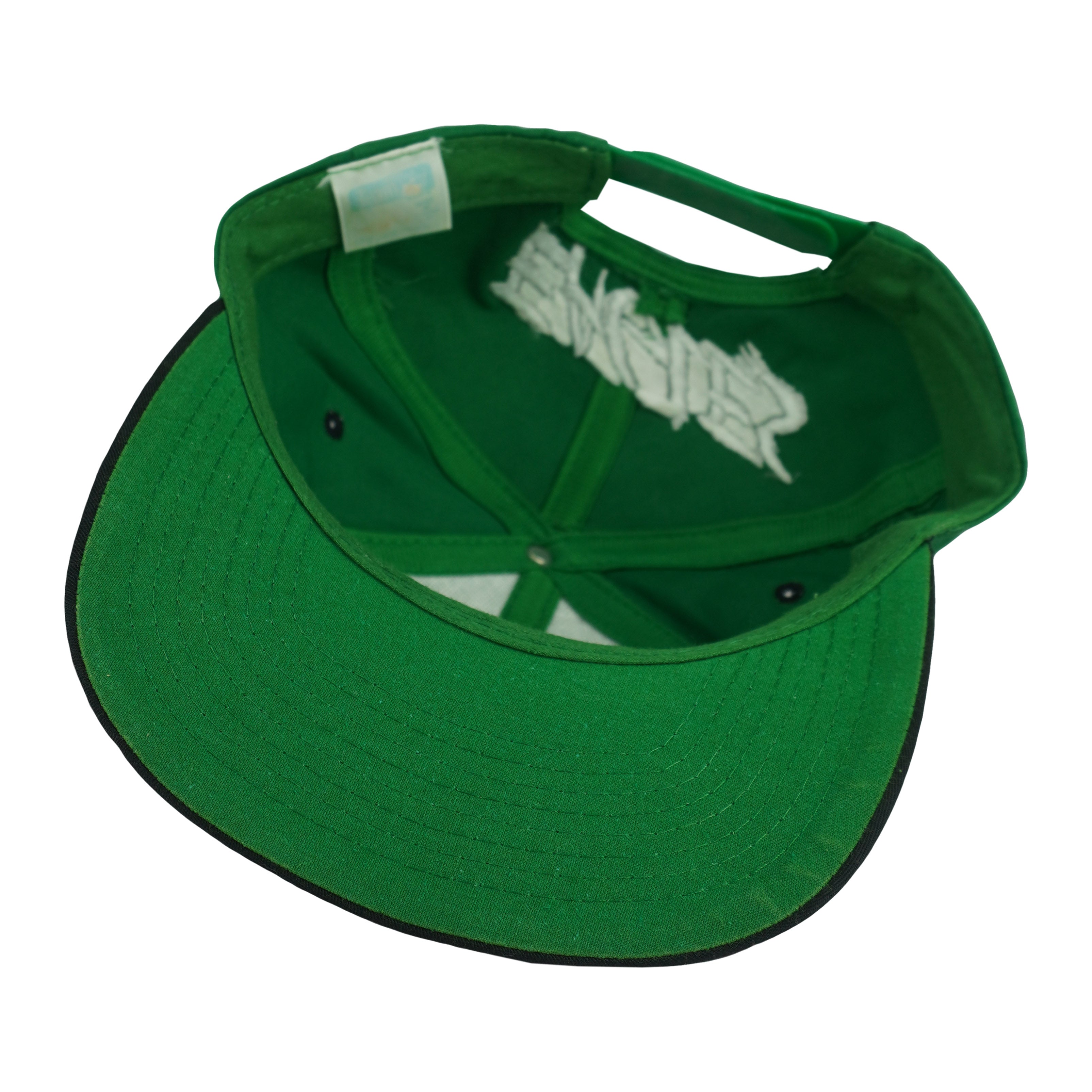 Interior and green underbrim view of the green and black Philadelphia Eagles wraparound-word snapback cap