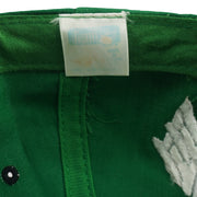 Faded inner brand label detail of the green and black Philadelphia Eagles wraparound-word snapback cap