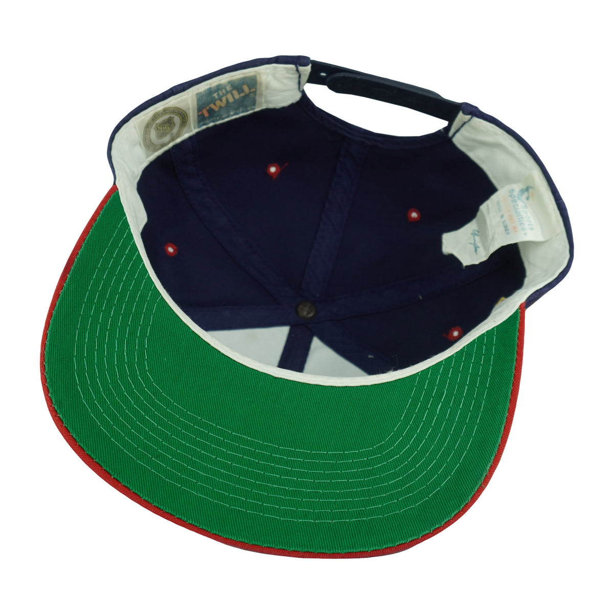 Interior and green underbrim view of the blue, red, and green Florida Panthers Sports Specialties snapback cap
