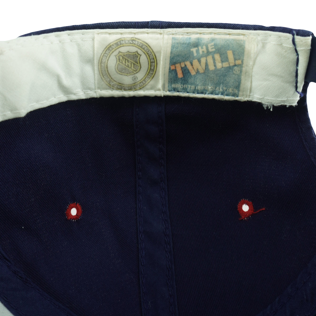 NHL and The Twill label detail of the blue, red, and green Florida Panthers Sports Specialties snapback cap