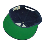 Interior and green underbrim view of the blue and green Boston Red Sox corduroy snapback cap