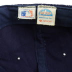 MLB label beside the AMPCAP label identifying Yupoong as the cap manufacturer