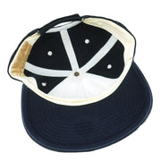 Interior of the dark New York Yankees cap with a white sweatband and navy brim underside