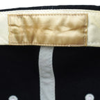 Close-up of the faded blank inner sweatband label on the New York Yankees hat