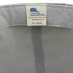 Close-up of the Athletic Headwear label sewn inside the gray Canada's Grain Train hat