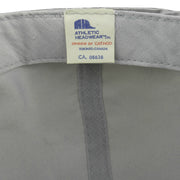 Close-up of the Athletic Headwear label sewn inside the gray Canada's Grain Train hat