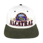 Front view of the white, black, and green 1990s The Rock Alcatraz scenic snapback hat