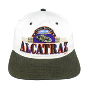 Front view of the white, black, and green 1990s The Rock Alcatraz scenic snapback hat