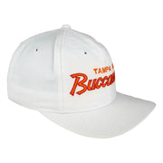 Angled white Buccaneers cap showing orange script embroidery and curved brim