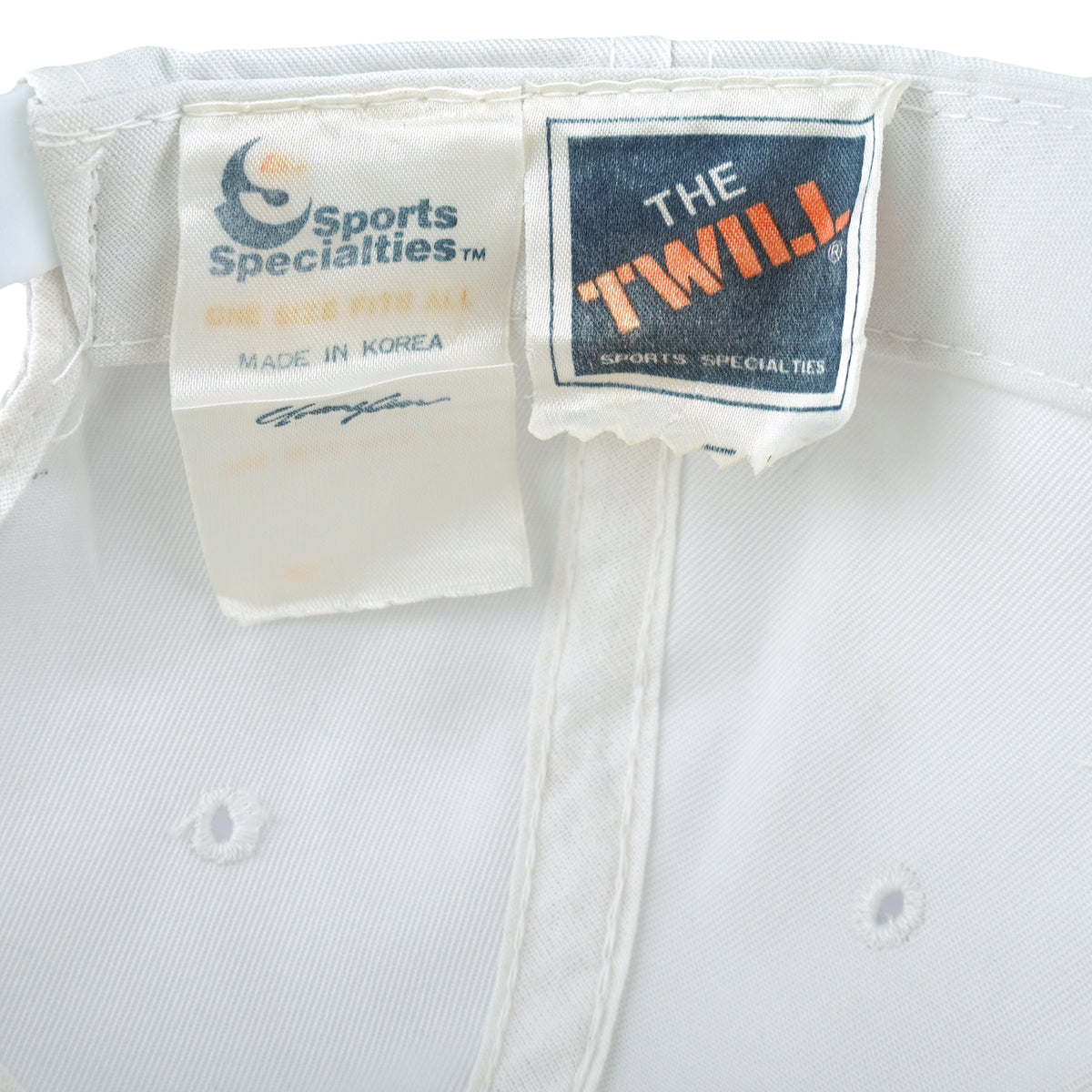 Close-up of the Sports Specialties and The Twill labels inside the Tampa Bay Buccaneers hat