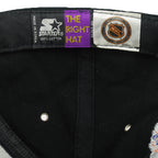 Black Starter label beside an orange NHL shield inside the Detroit Red Wings cap